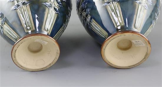 Eliza Simmance for Royal Doulton, a pair of Art Nouveau lily design bottle vases, c.1910, 30cm